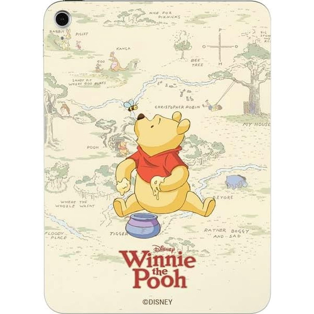 Skinit Winnie the Pooh decal skin applied to the back of an Apple iPad 10th Gen tablet.