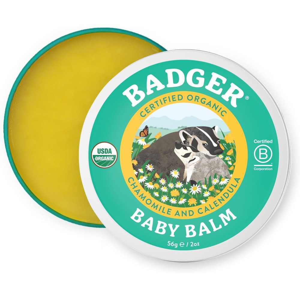 Badger Organic Baby Balm front view of the two ounce metal tin showcasing the brand logo and chamomile illustration