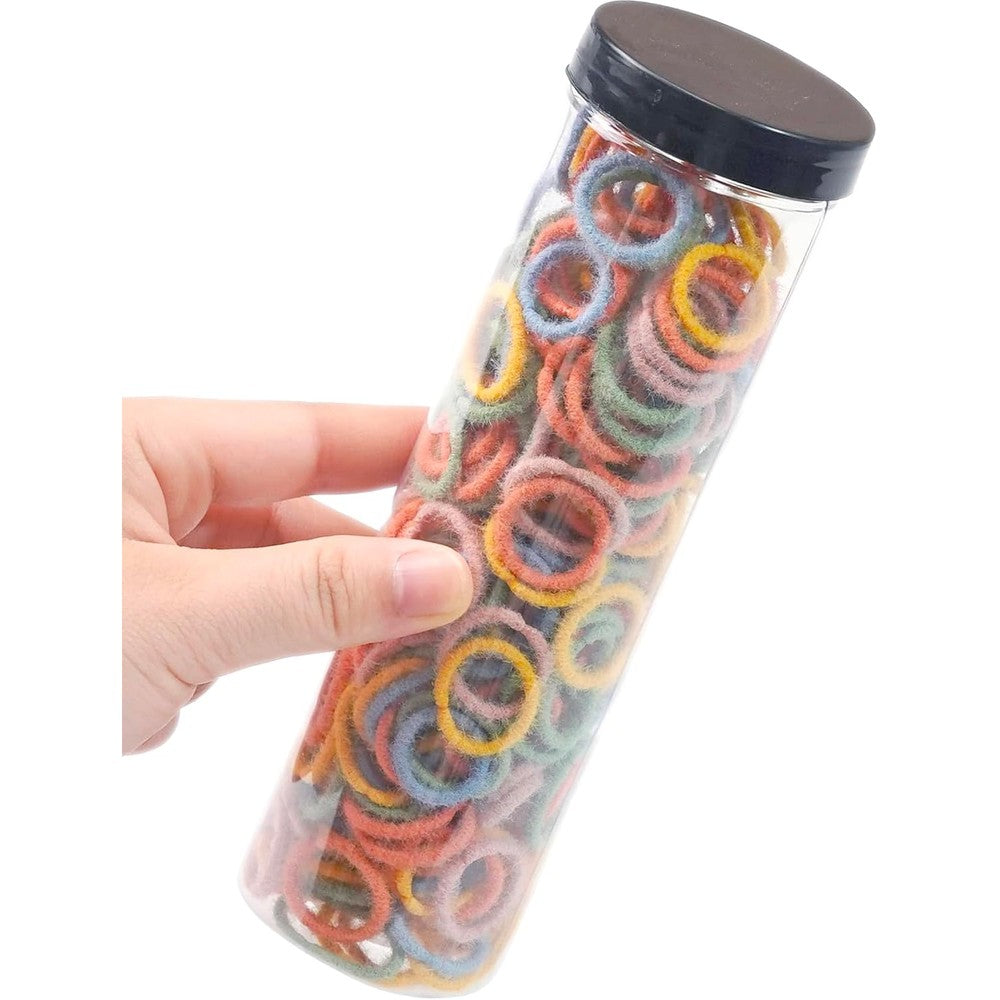 JOYOYO 300 Count Small Hair Ties front view of cylindrical storage container filled with multicolor elastic bands