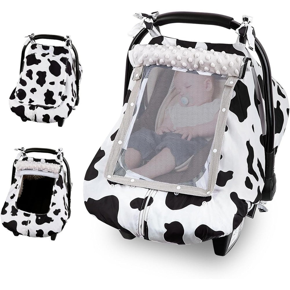FIOBEE baby car seat cover in white and black cow print front view on infant carrier
