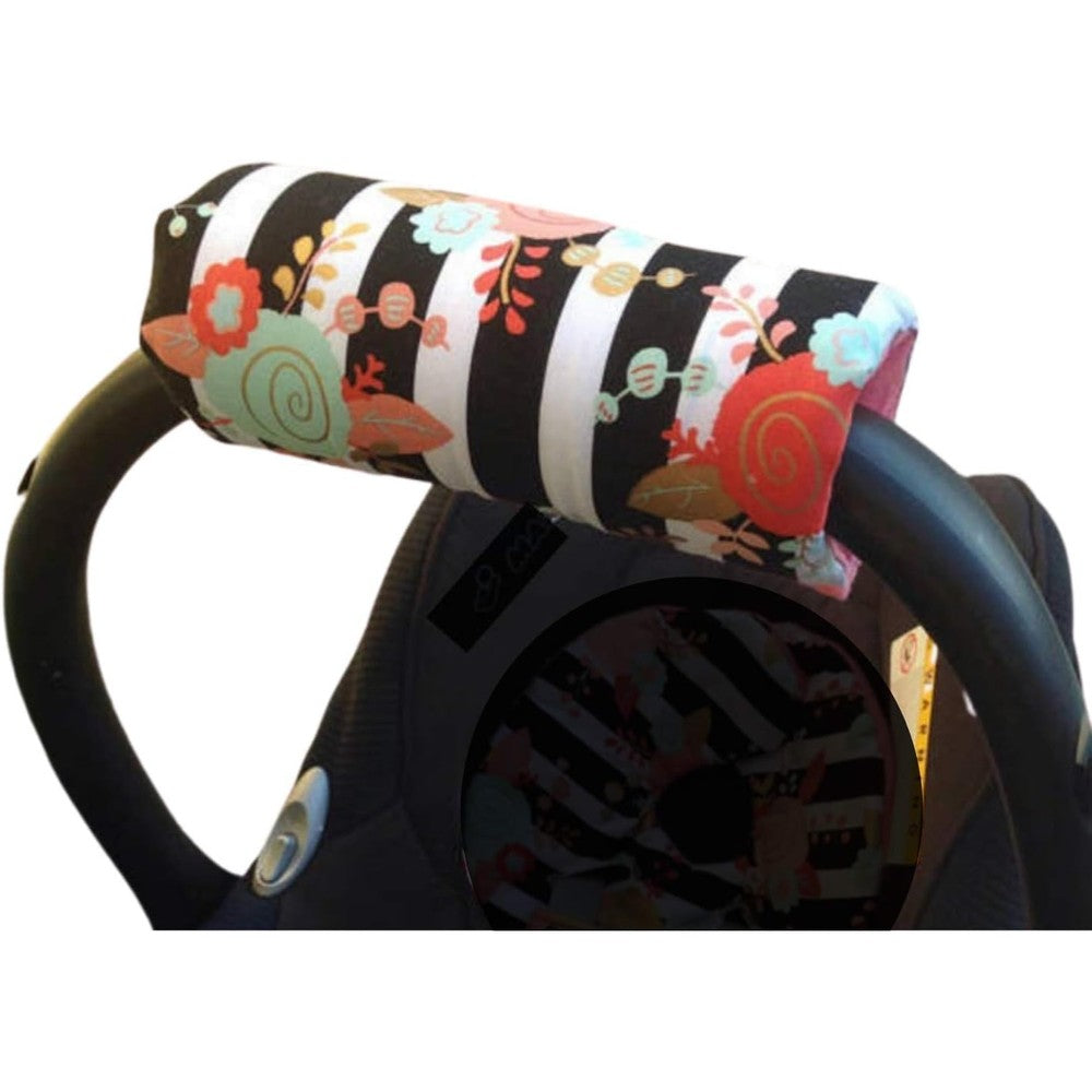 Handmade car seat carry handle cushion front view showing black and white striped floral pattern