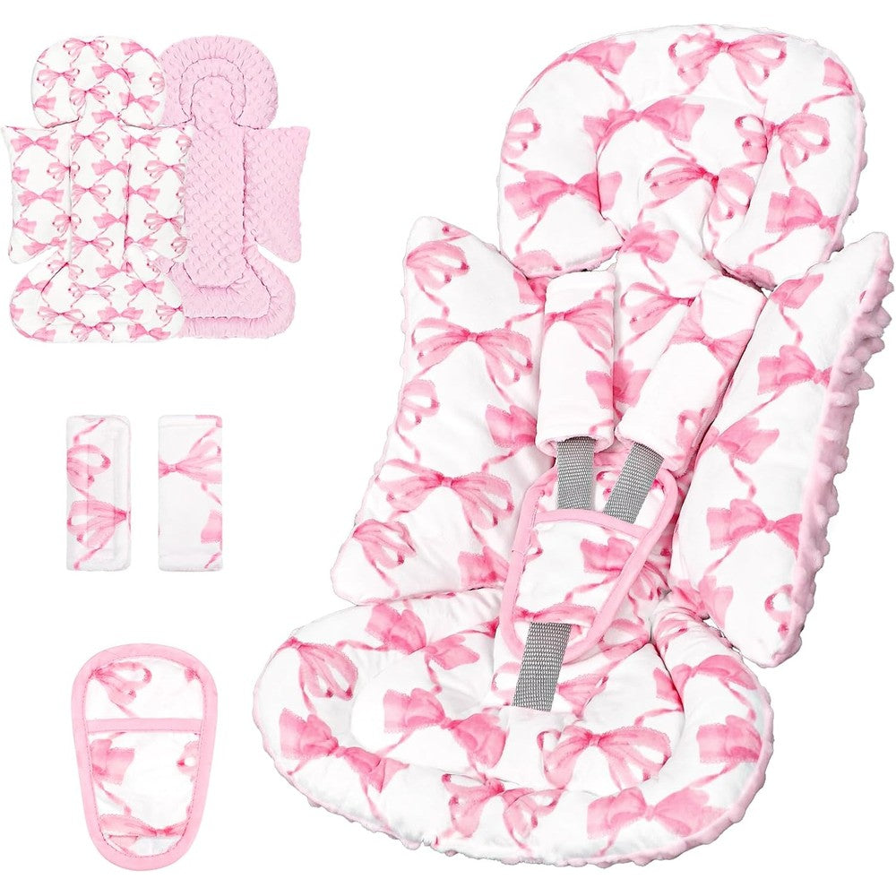 Munific infant car seat insert front view featuring pink bow pattern and matching shoulder strap pads.