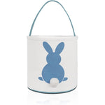 MONOBLANKS Easter bunny basket bag blue front view showing rabbit print and fluffy tail accent.