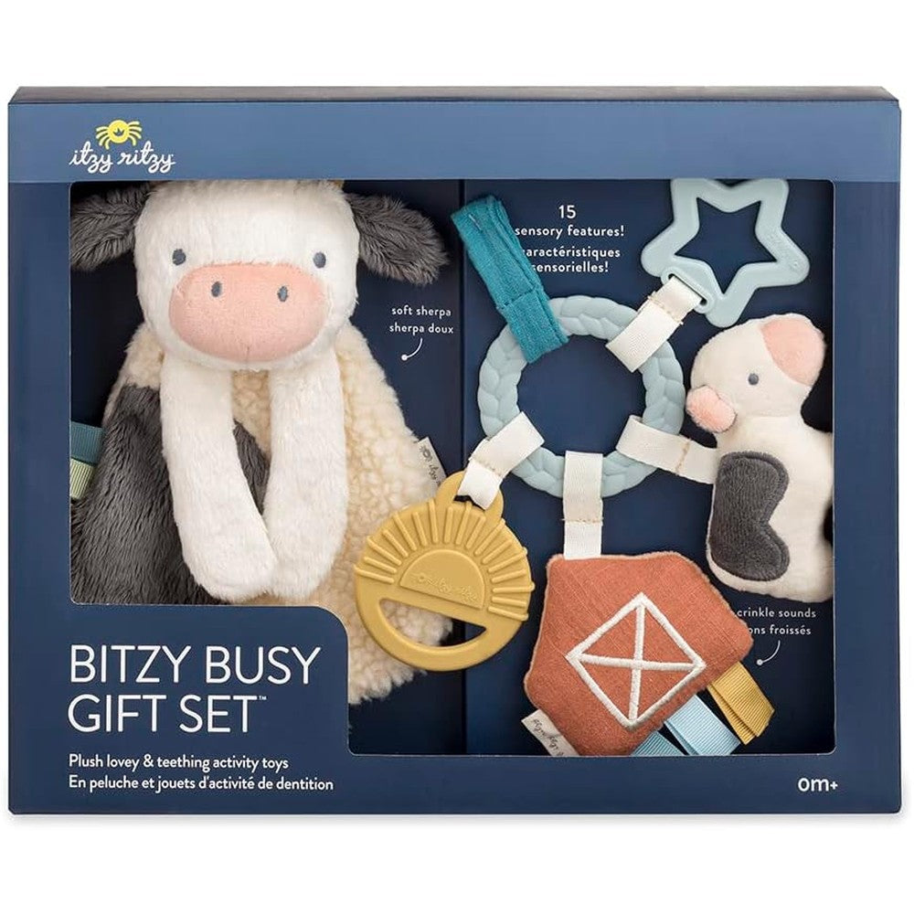 Itzy Ritzy Farm Toy Gift Set featuring cow lovey and busy ring