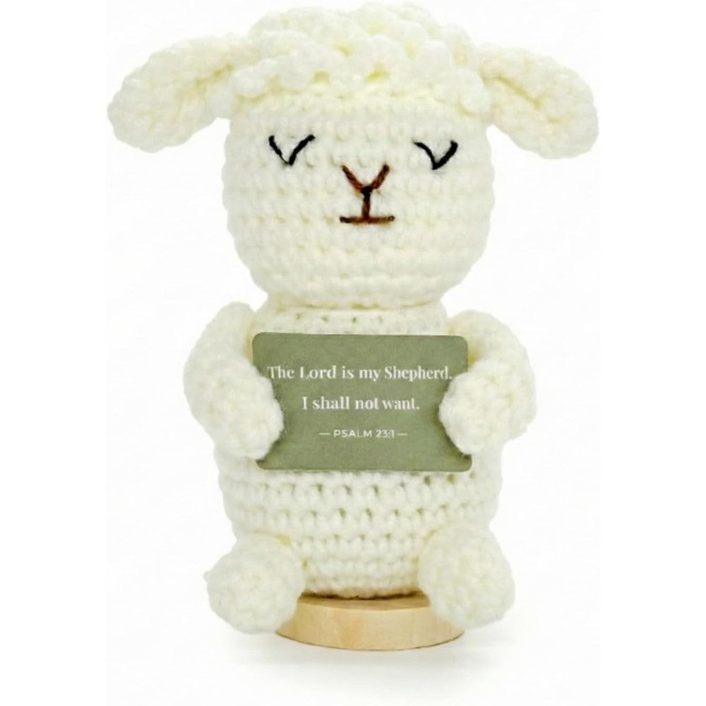LUDEONA handmade crochet lamb standing front view on a wooden base holding scripture card