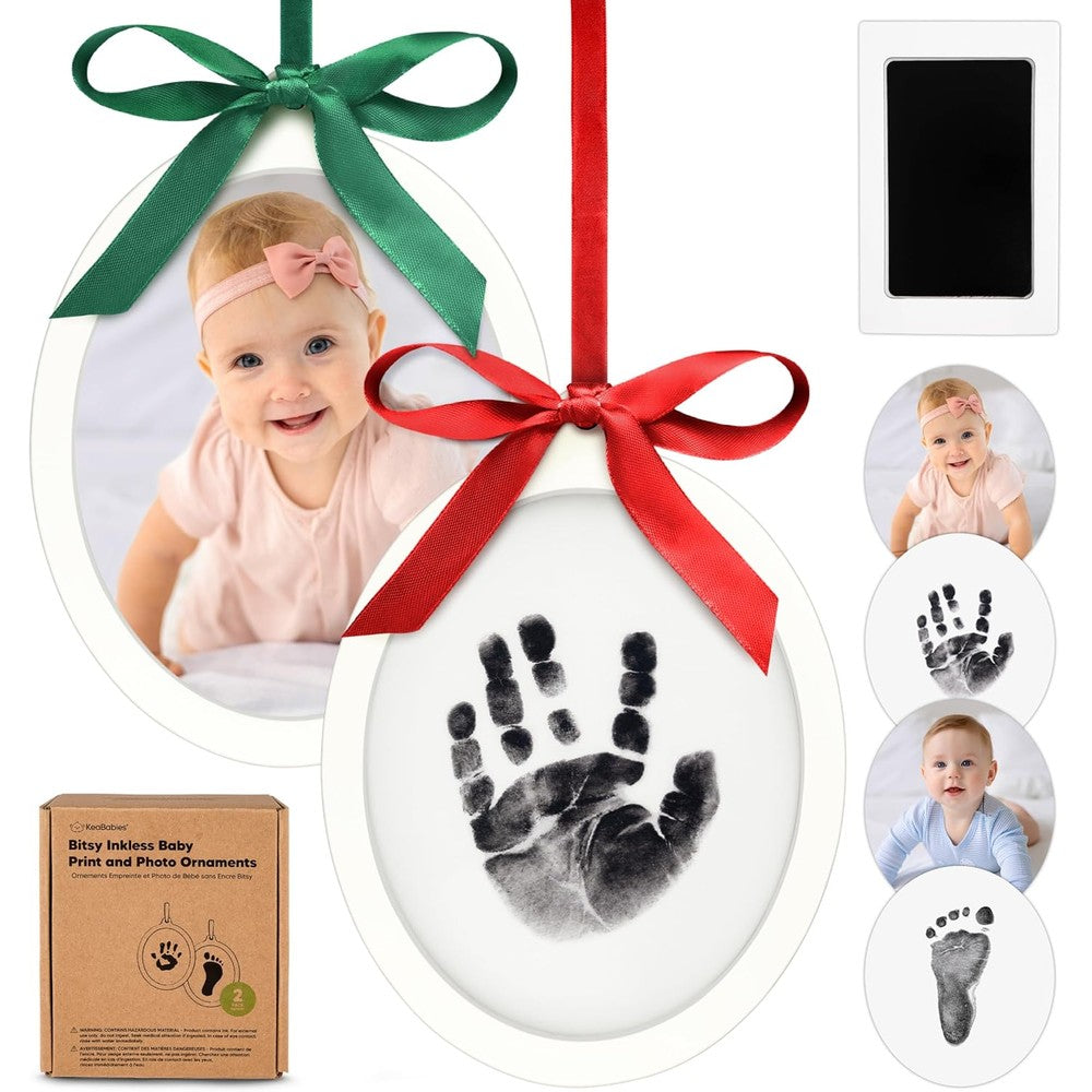 KeaBabies inkless baby hand and footprint kit front view showcasing the alpine white wooden frame with a baby photo and foot impression.