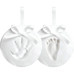 Reece Studio Baby Handprint and Footprint Christmas Ornament Kit front view showing DIY clay keepsakes with white ribbons.
