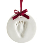 Pearhead Babyprints Keepsake Ornament kit front view packaging showing newborn footprint sample