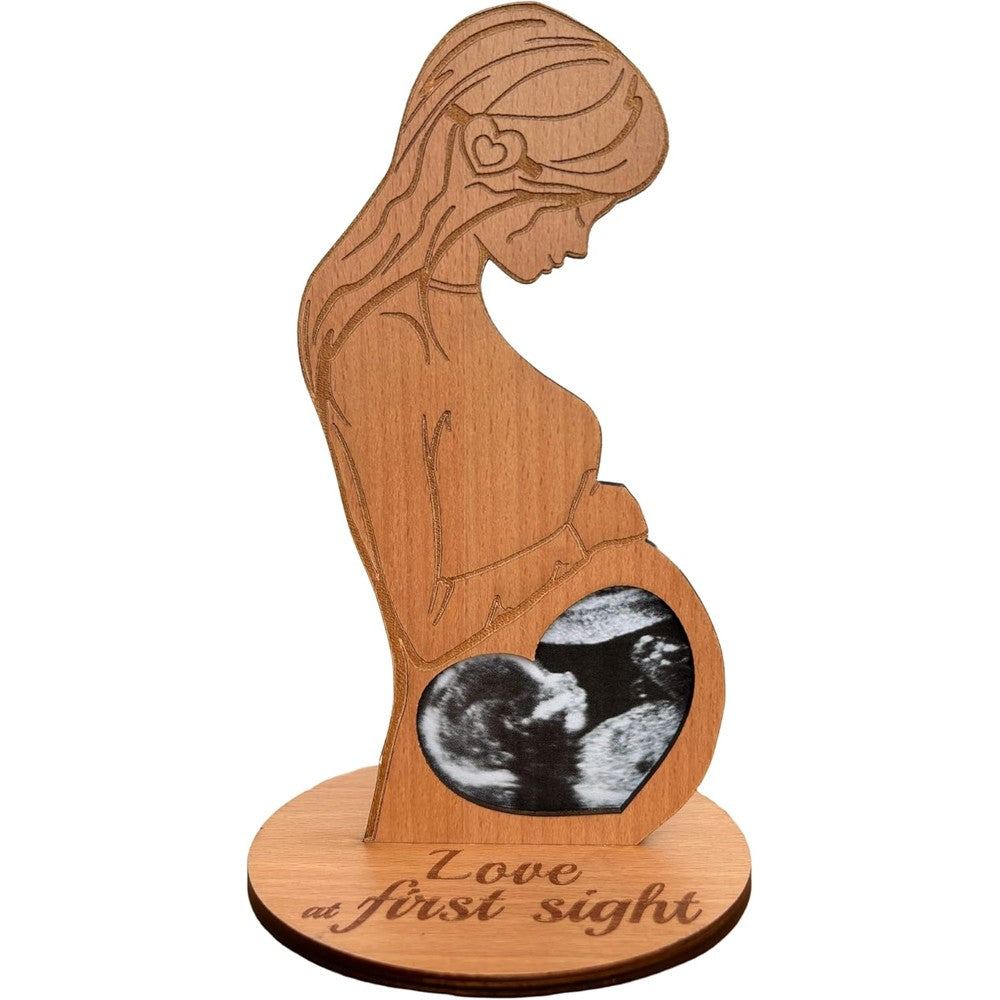 Heart's Sign Baby Ultrasound Photo Frame front view showing pregnant woman wooden silhouette and love at first sight engraving.