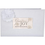 The Grandparent Gift Co. Grandmas Joy photo album front view showing white faux suede cover and flower accent
