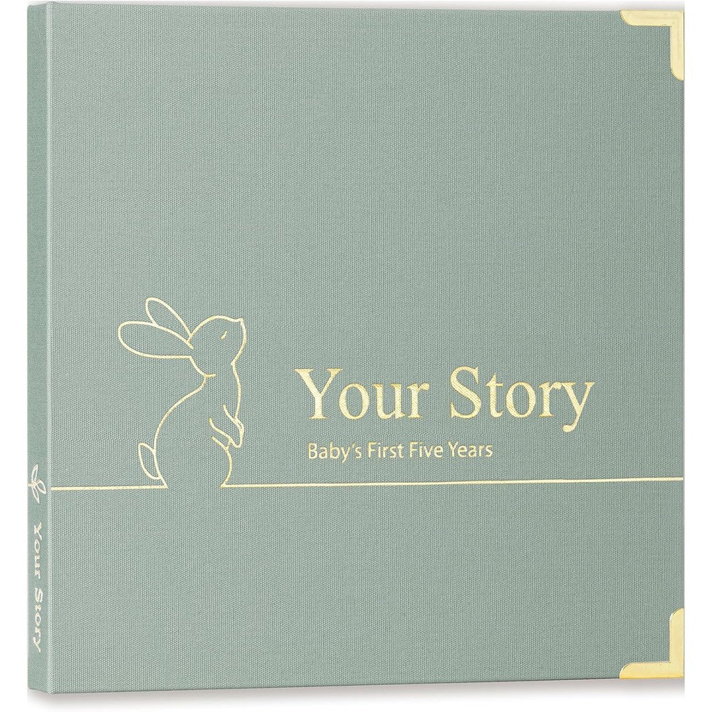 Olive And Lark baby memory book keepsake front cover view showing sage green linen texture and gold corners