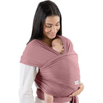 Comfy Cubs Baby Wrap Carrier in mauve front view on a caregiver carrying a newborn baby.
