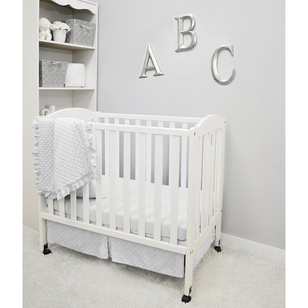 American Baby Company Heavenly Soft Minky Dot Three Piece Mini Crib Bedding Set in white front view showcasing the plush ruffled comforter.