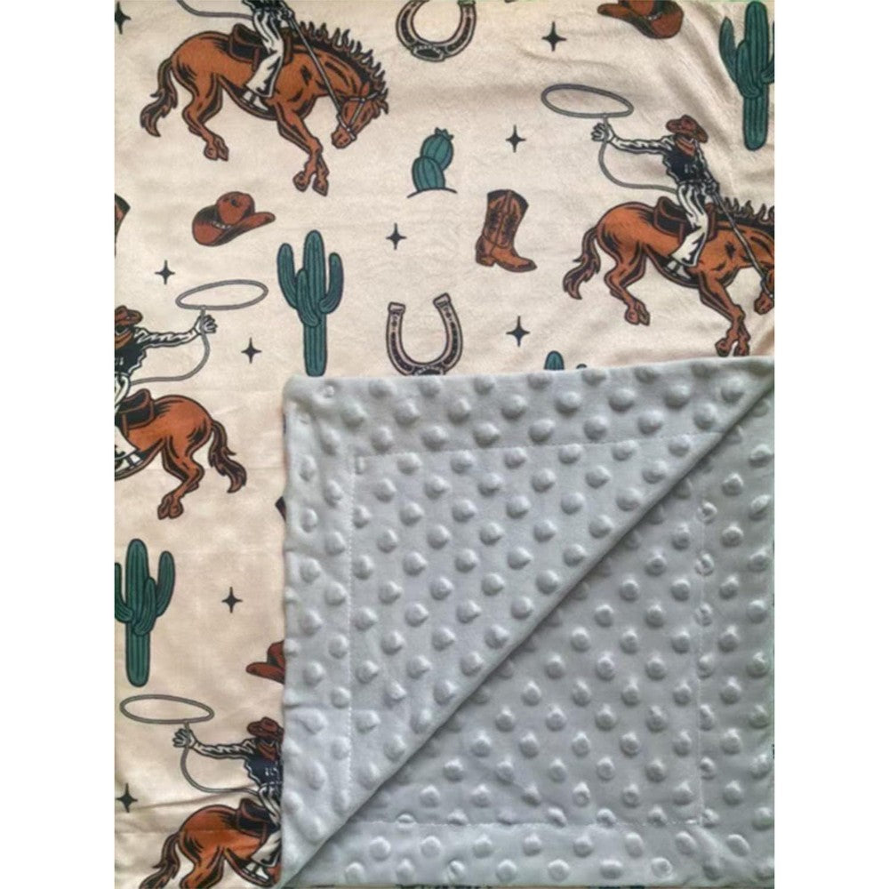 CLOSOCKEY baby blanket front view showing the cute western cowboy cow print pattern.