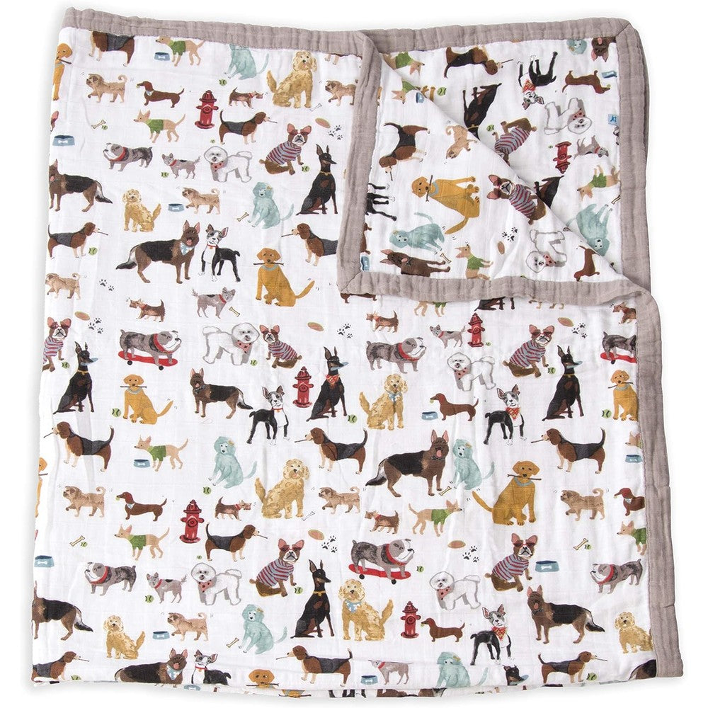 Little Unicorn Premium Quilted Throw front view showcasing the full Woof dog breed print on white cotton muslin fabric
