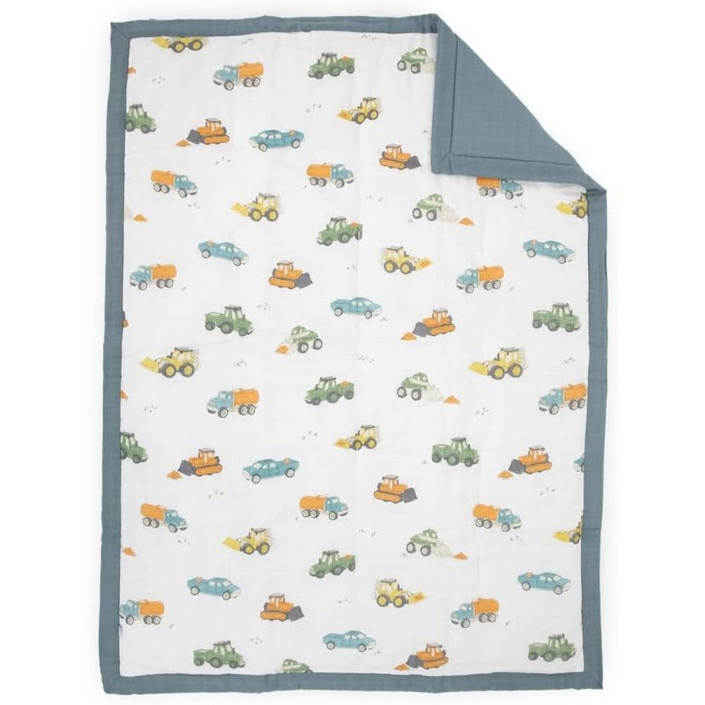 Little Unicorn cotton muslin toddler comforter front view showing work trucks print.