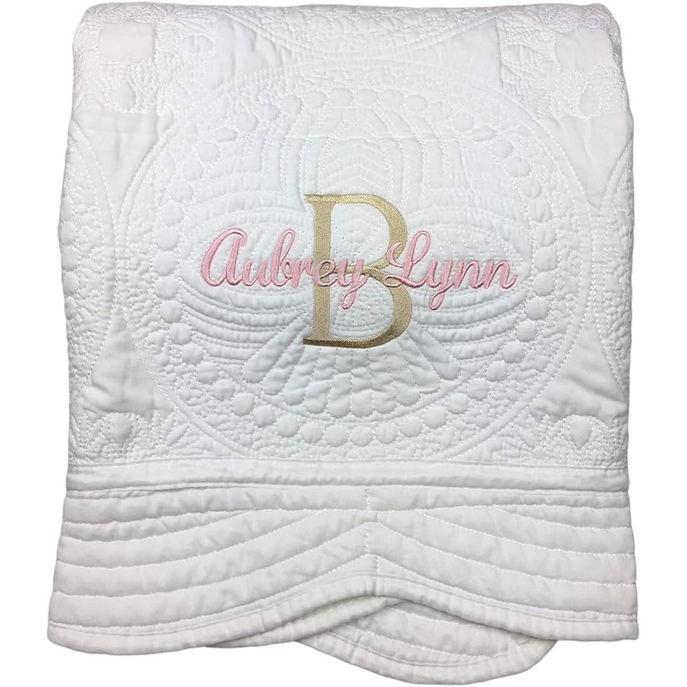 Little Lulus Gifts Personalized Baby Quilt front view showing white fabric with delicate pink and gold custom embroidery