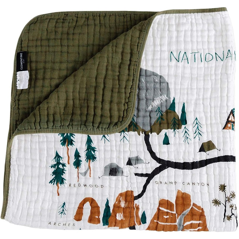 Clementine Kids National Parks Reversible Quilt front view showing artistic nature illustrations.