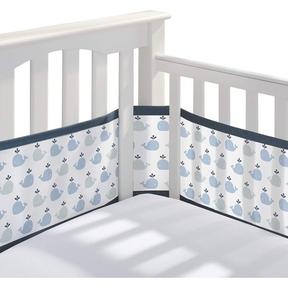 BreathableBaby breathable mesh crib liner little whale navy front view installed on a full size white wooden crib