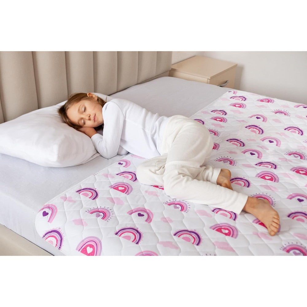 Lynmark potty training mattress protector front view showcasing the colorful rainbow design spread across a toddler bed.