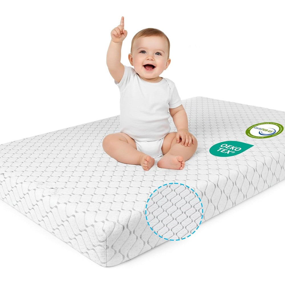 WEVFGHI pack and play mattress pad front view showcasing the white quilted breathable cover inside a standard playard.