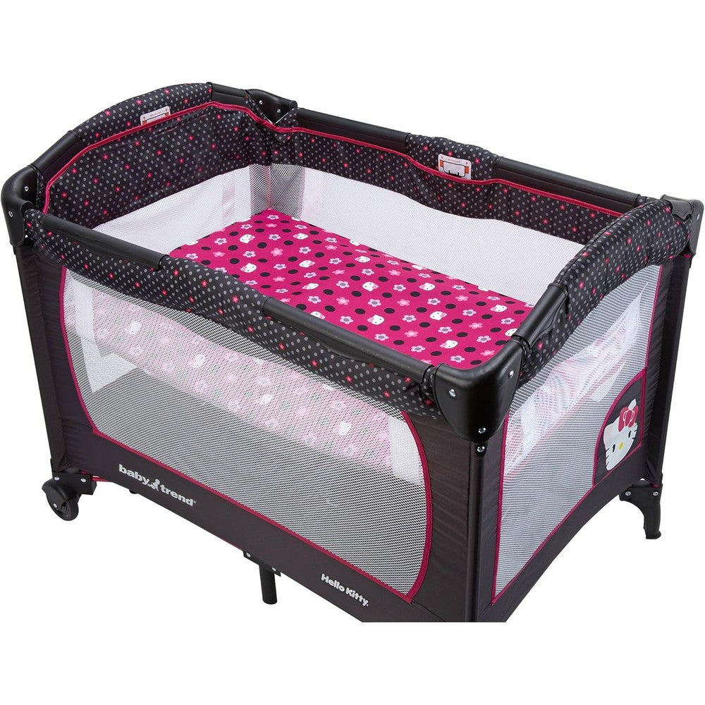 Crown Crafts Hello Kitty Play Yard Fitted Sheet front view showing pink and black character pattern on nursery mattress pad