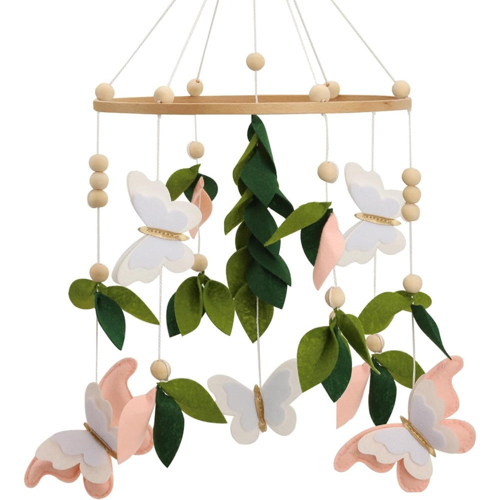 Wenqik butterfly mobile for crib front view featuring pink and white felt butterflies hanging over a wooden cot.