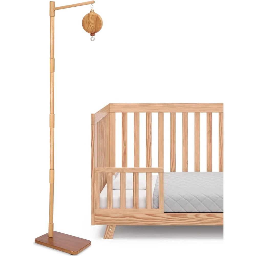 Ebingmima floor standing crib mobile arm front view showing the natural beech wood finish in a modern nursery setting.
