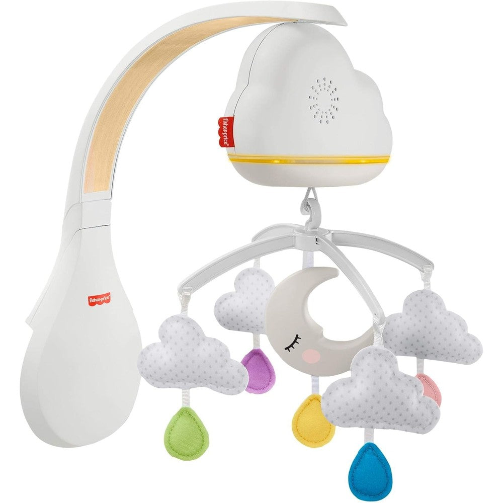 Fisher-Price Calming Clouds Mobile And Soother attached to a baby crib showing plush hanging clouds and moon