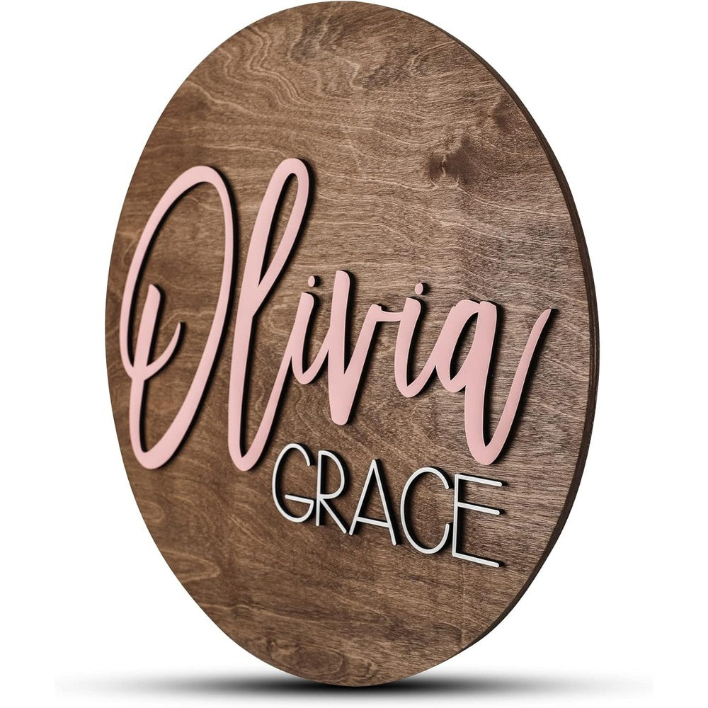 Hickory Hollow Designs custom round nursery name sign front view hanging above a crib