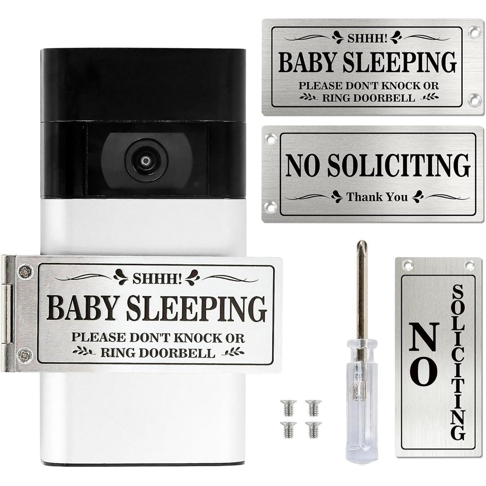 Kadezia baby sleeping doorbell cover front view showing the rotatable silver metal sign on a wooden house door.