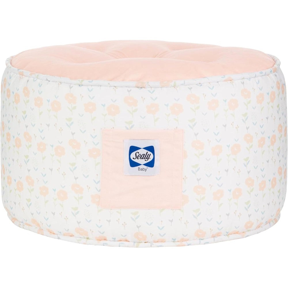 Sealy Baby Pouf toddler ottoman front view in coral and blossoms floral pattern