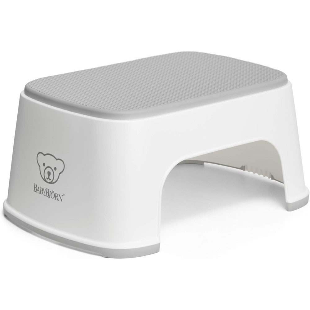 BabyBjörn Step Stool White and Gray front view showing the textured non slip rubber top surface for toddler safety.
