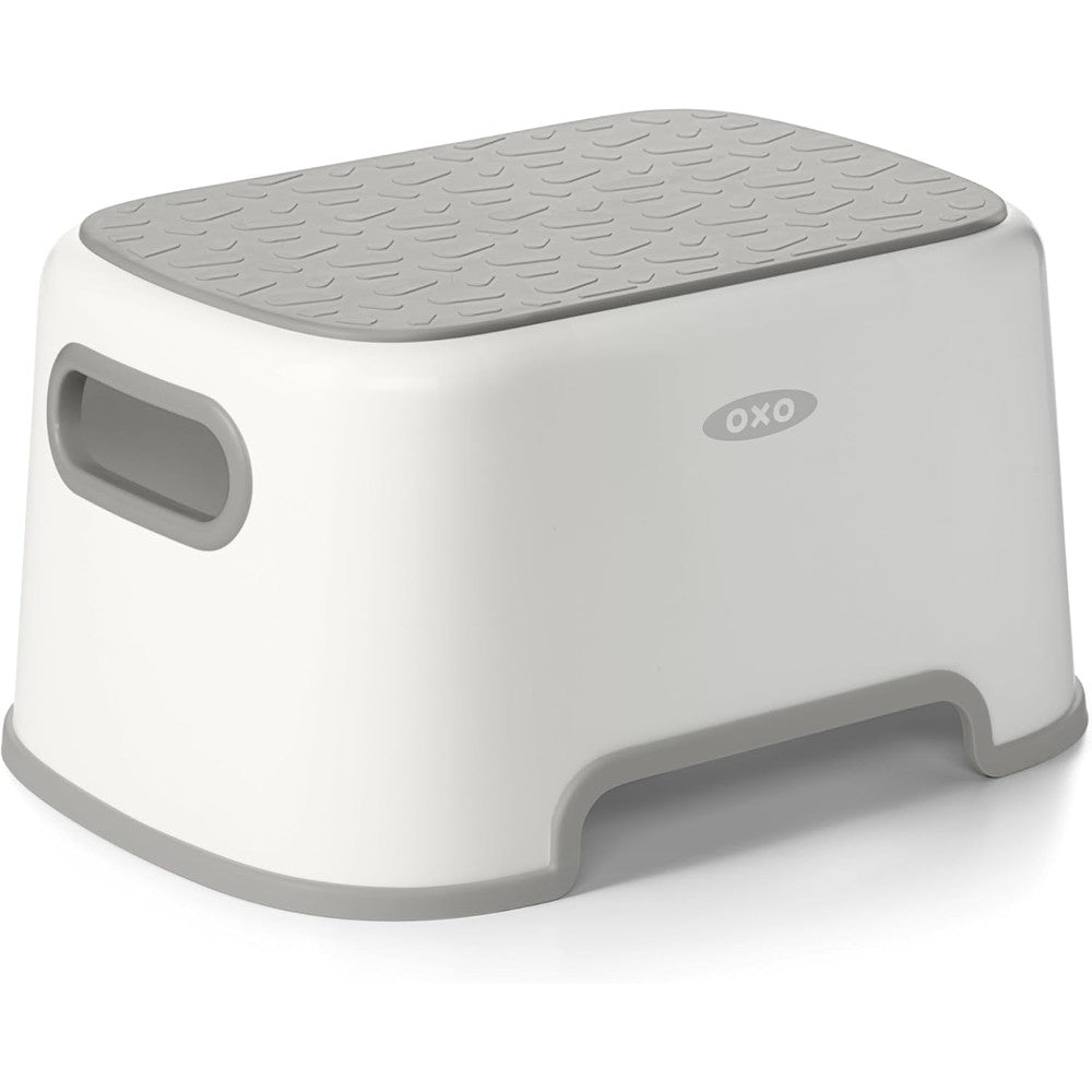 OXO Tot Step Stool Gray front view showing the clean white and gray design with non slip top surface pattern.