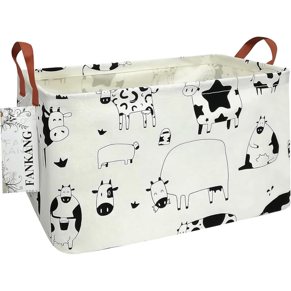 FANKANG canvas laundry basket front view showcasing the playful cow print design for home organization.