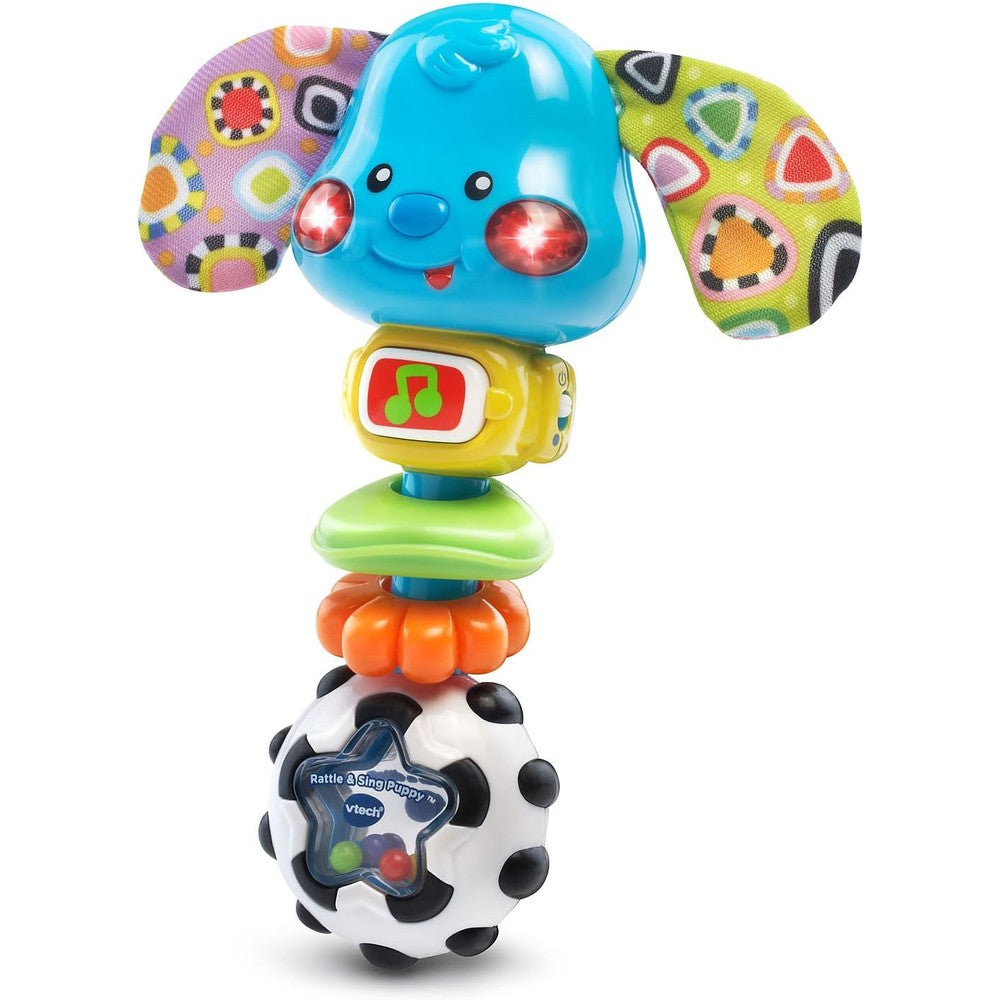 VTech Baby Rattle and Sing Puppy front view showing the multicolor electronic toy with light-up cheeks.