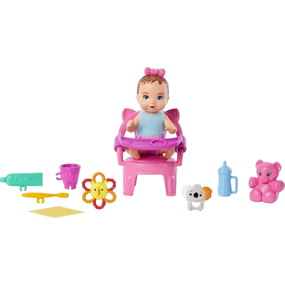 Barbie Skipper Babysitters Inc First Tooth Playset showing front view of packaged baby doll and pink highchair.