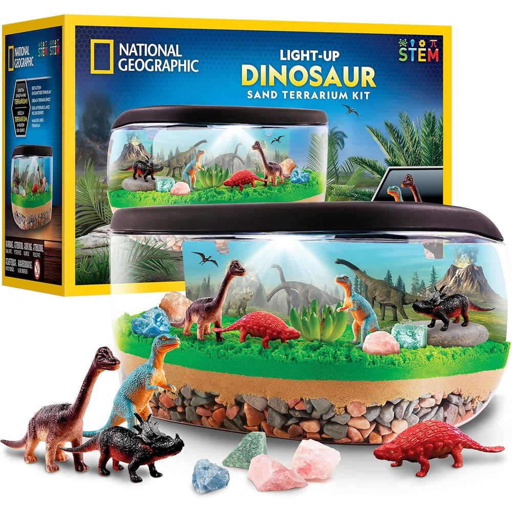 National Geographic Light Up Dinosaur Terrarium Kit front view showcasing the illuminated prehistoric habitat with sand and dinosaur figures.