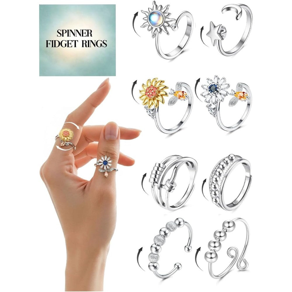 Kakonia fidget anxiety rings 8 piece set front view showing assorted silver plated spinner designs