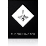 BruceCharlesDesigns Stainless Steel Spinning Top front view on desk