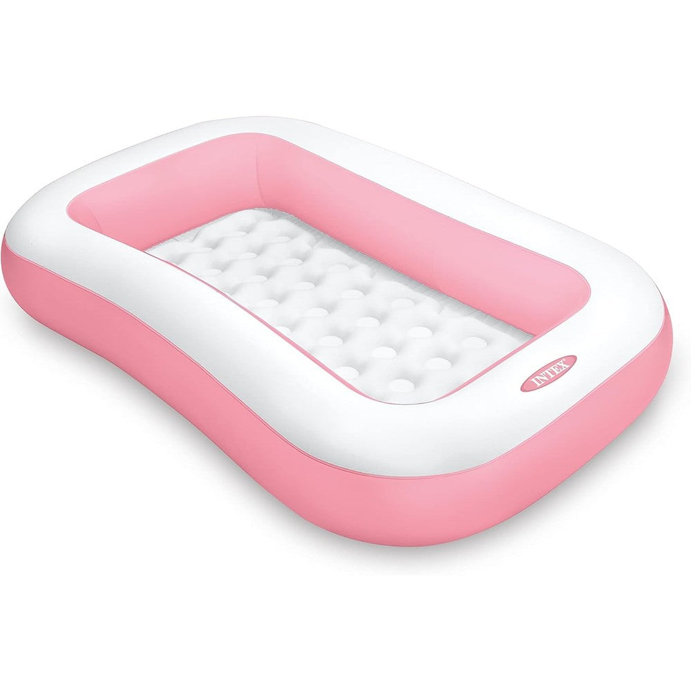 Intex Swim Center inflatable family pool front view showcasing the vibrant pink rectangular design on a garden lawn.