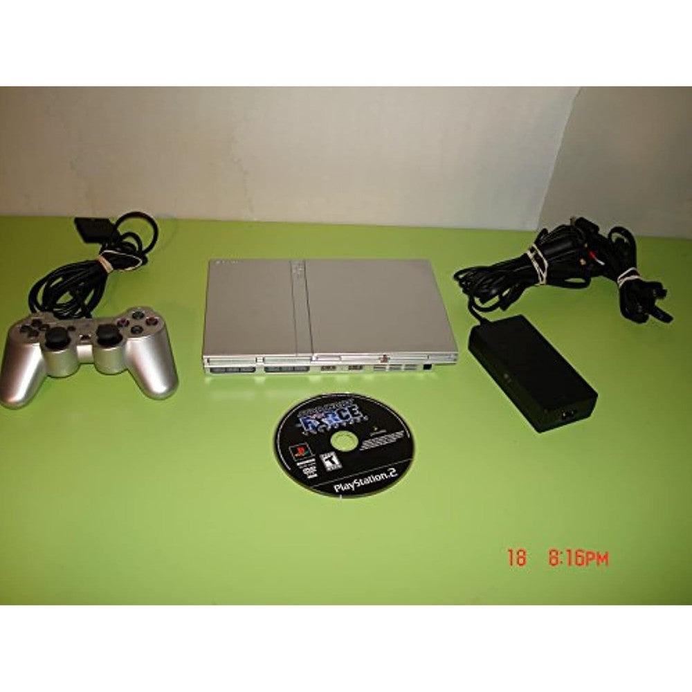 Sony PlayStation 2 Slim Silver Console front view showcasing the top-loading tray and sleek compact retro gaming hardware design.