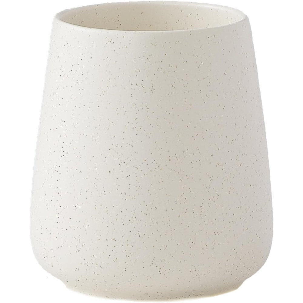 Eyrozia beige ceramic toothbrush holder front view on bathroom countertop