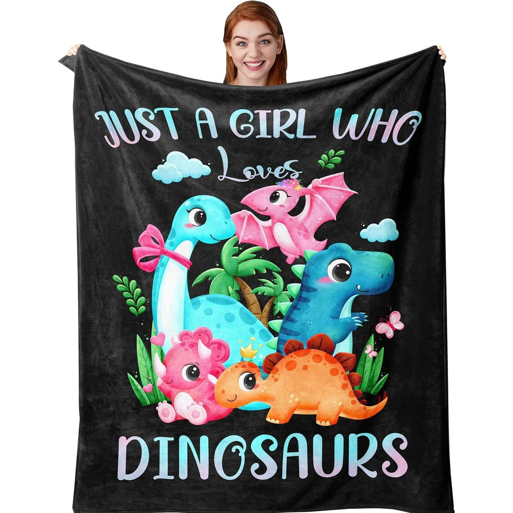 Amonee-YL dinosaur blanket front view showing pink flannel throw with cartoon graphics