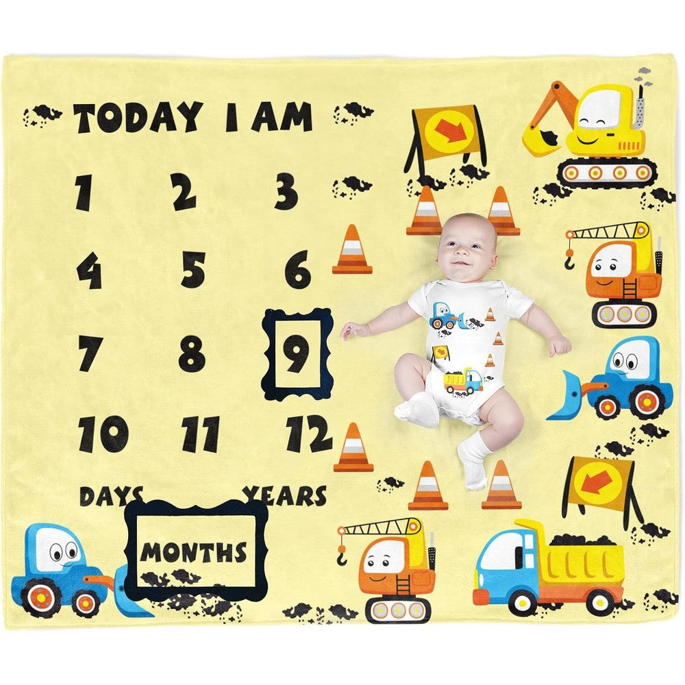 PAMBO construction vehicle baby milestone blanket laid flat showcasing yellow excavator and dump truck illustrations