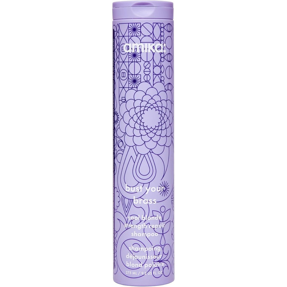 Amika Bust Your Brass Cool Blonde Strength Repair Shampoo front view of purple patterned bottle.
