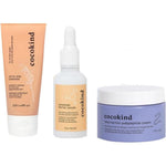Cocokind Daily Routine skin barrier repair set front view showcasing the cleanser serum and cream packaging.