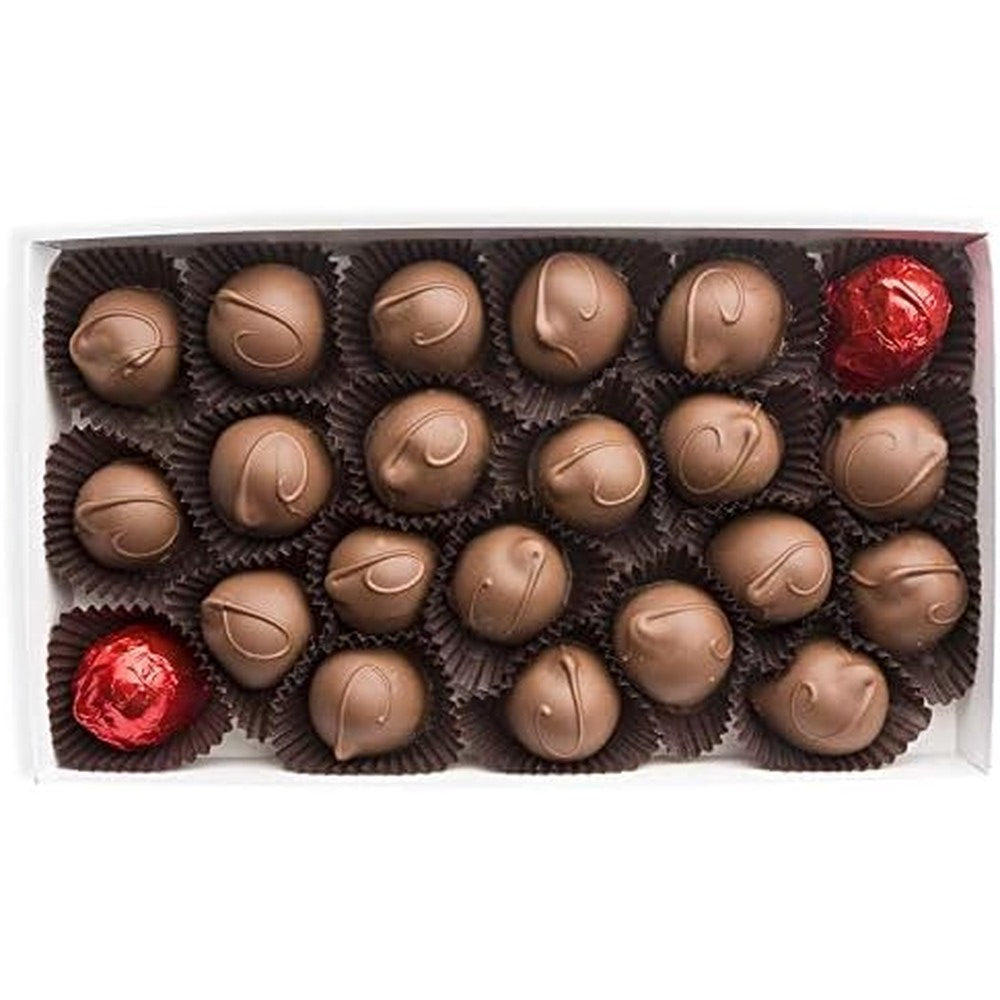 A box of assorted chocolates featuring 20 milk chocolate truffles in dark brown paper cups and 2 red foil wrapped chocolates at the top left and bottom right, presented in a white box against a white background.