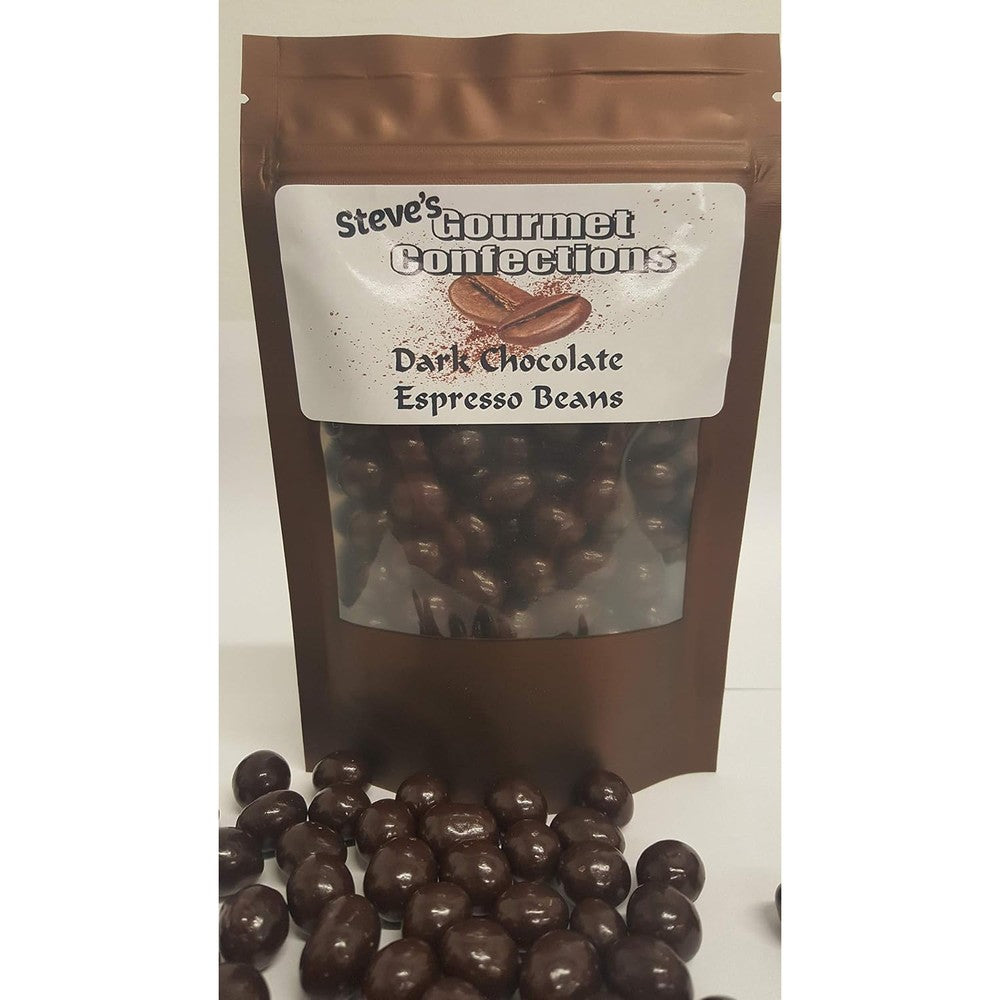 A brown stand-up pouch labeled 'Steve's Gourmet Confections Dark Chocolate Espresso Beans' with a clear window showing chocolate-covered beans inside, plus several loose dark chocolate beans in front on a white background.